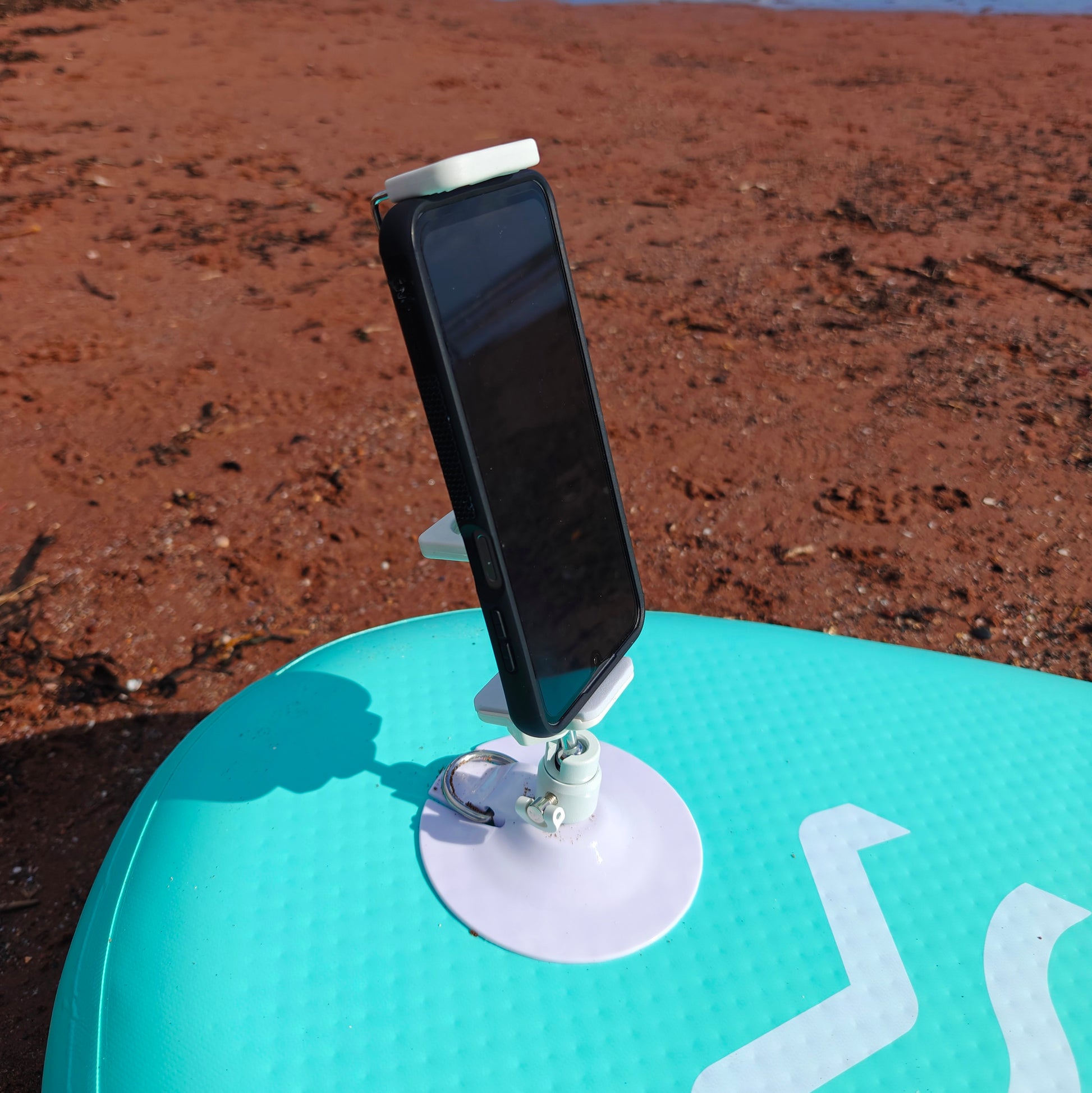 Phone mounted on a stand on paddleboard